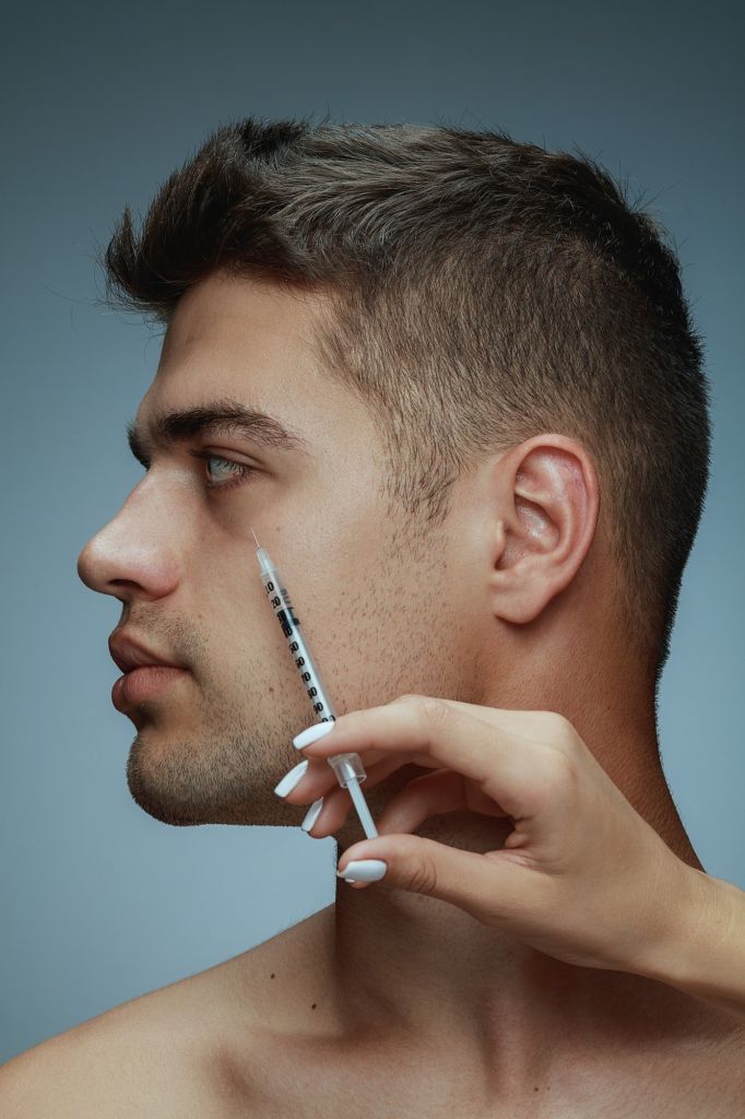 close-up-profile-portrait-of-young-man-isolated-on-grey-studio-background-filling-surgery-procedure-concept-of-men-s-health-and-beauty-cosmetology-self-care-body-and-skin-care-anti-aging.jpg